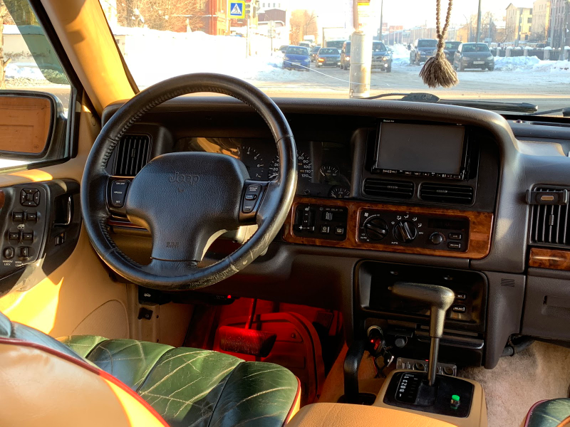 Illustration for article titled The Jeep Grand Cherokee You Never Knew: Inside Russia’s Wild '90s and the SUV That Ruled Its Roads